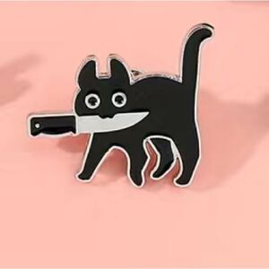 Black cat with knife enamel pin